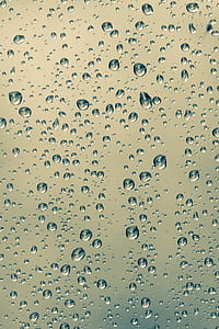 close-up photography of water drops on glass thumbnail