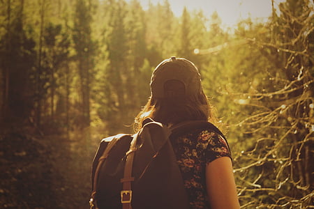 woman carrying black backpack thumbnail