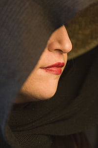 woman's red lips wearing black cloak thumbnail