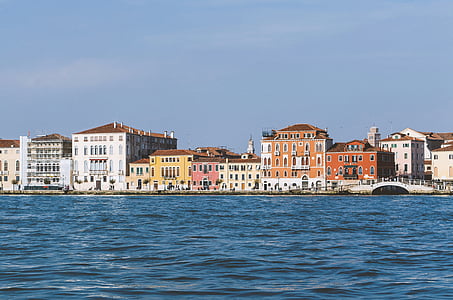 concrete buildings near body of water thumbnail