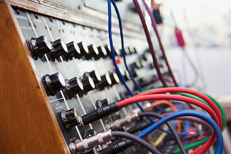 assorted-color coated cables plugged in audio mixer thumbnail