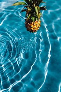 Pineapple in a swimming pool thumbnail