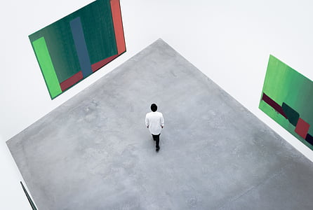 person standing inside empty lighted room thumbnail