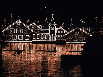 silhouette photo of lighted Christmas mansion thumbnail