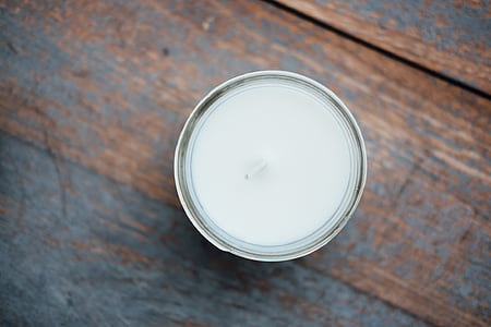 gray tealight on brown wooden surface thumbnail