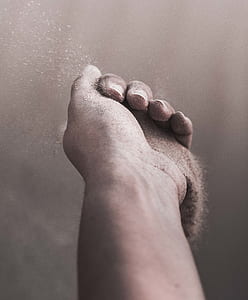 person holding sand thumbnail