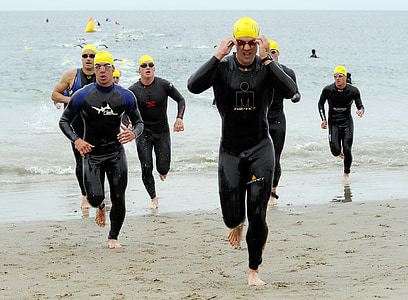 photo of men walking along seashore thumbnail