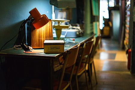 white box on table near table lamp and chairs thumbnail