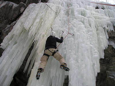 man climbing on ice wall thumbnail