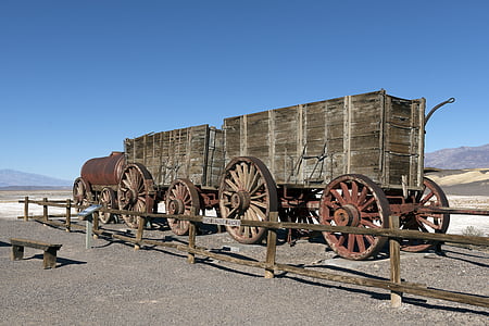brown wooden trailers near fence thumbnail