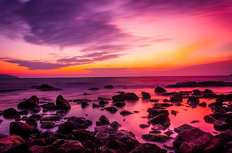 brown stones on ocean thumbnail