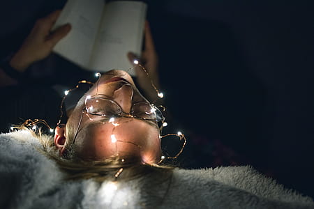 top-view of woman with eyeglasses reading book thumbnail
