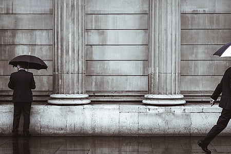 man under black umbrella thumbnail