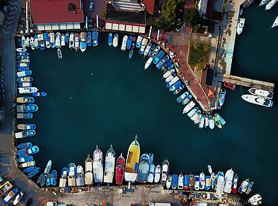 aerial photography of boats docked beside buildings thumbnail