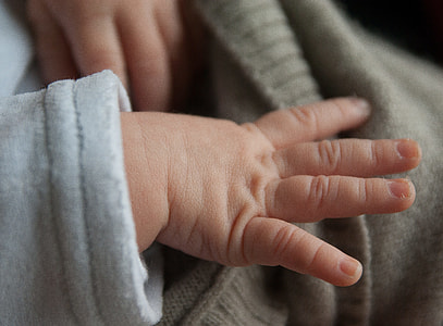 closeup photography of baby hand thumbnail