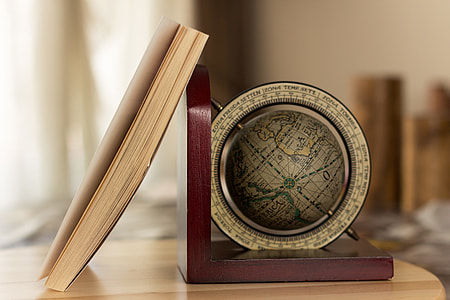 brown book beside brown bookend thumbnail