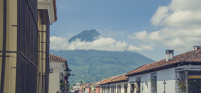 white and brown houses near mountain thumbnail
