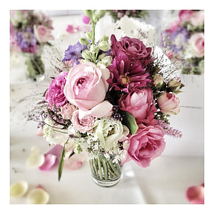 white, pink, and purple roses with baby's breath flowers bouquet centerpiece thumbnail