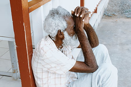 man leaning on wooden wall thumbnail