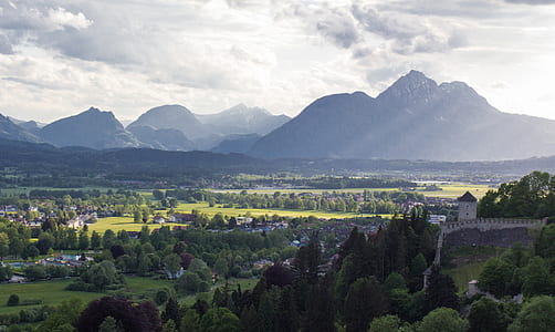 mountains near trees under white clouds thumbnail