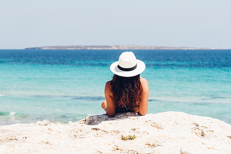 Woman Lying on White Sand Beach thumbnail