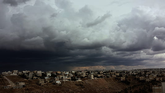 high-rise buildings under gray clouds thumbnail