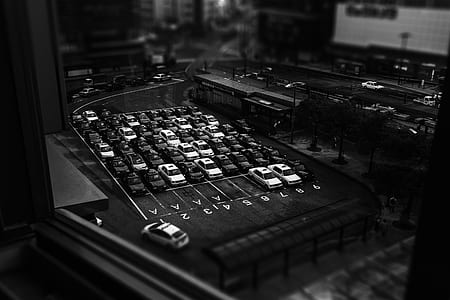 aerial grayscale photo of cars on parking lot thumbnail