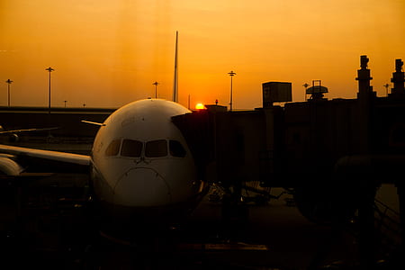 Silhouette of Airplane on Airport during Sunset thumbnail