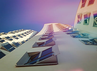 low-angle photography of white concrete building during daytime thumbnail