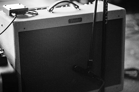 graycale photography of guitar amplifier thumbnail