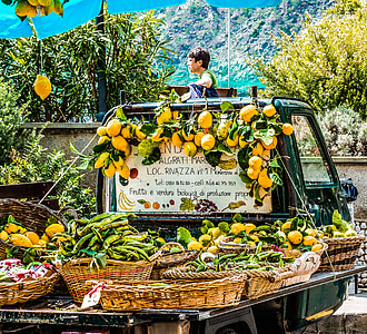 yellow fruit and green vegetables on wicker baskets thumbnail