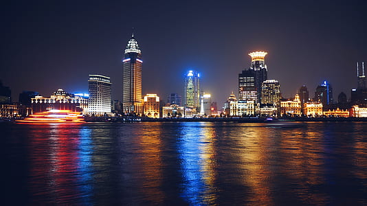 city buildings near body of water thumbnail