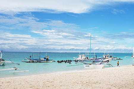 white boat floating on body of water thumbnail