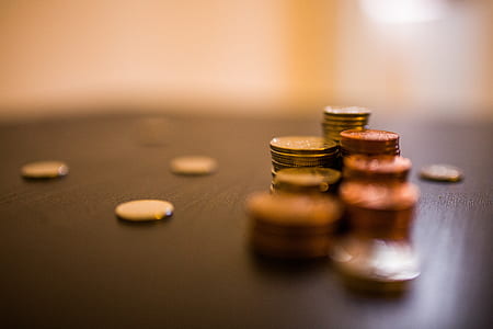 assorted coin lot on brown wooden table thumbnail