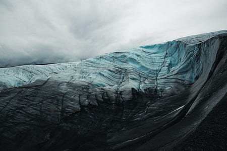 mountain rage view under cloudy sky during daytime thumbnail