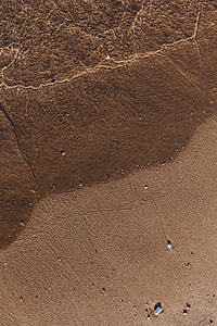 Soft wave of the sea on the sandy beach thumbnail