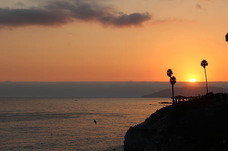 island and ocean during golden hour thumbnail