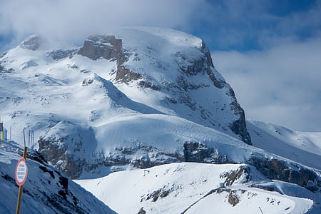 snow cap mountain under cloudy sky at daytime thumbnail