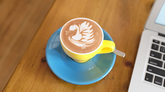 teacup with cappuccino on table thumbnail