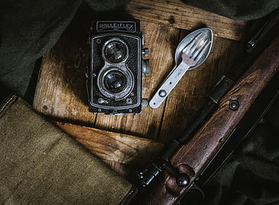 flat lay photo of land camera beside utensil thumbnail