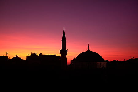 silhouette photo of dome under golden sky thumbnail