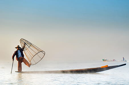 Man Wearing Jacket Riding Canoe thumbnail