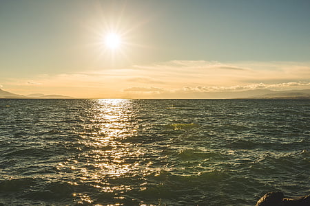 body of water under sunrise thumbnail