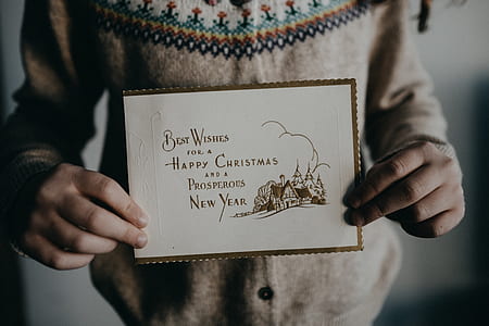 person holding best wishes card thumbnail