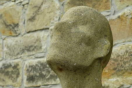 close-up photography of faceless man statue thumbnail