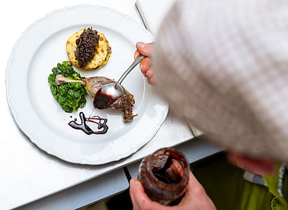 Green Salad Caviar on Beige Pancake Garnished With Chocolate Syrup on White Round Ceramic Dining Plate thumbnail