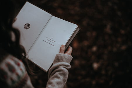 person holding book thumbnail