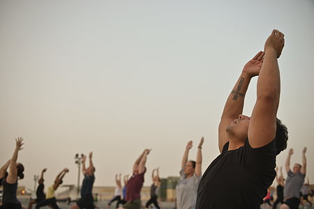 people doing morning stretching during daytime thumbnail