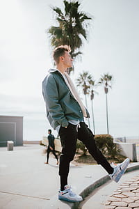 shallow focus photography of man standing on one leg thumbnail