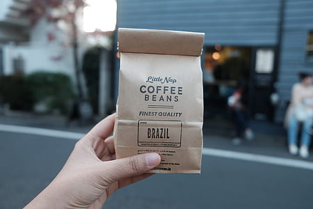 person holding Coffee Beans pack thumbnail
